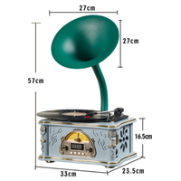 Gammal grammofon med designklocka